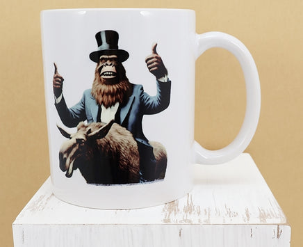 TwoAcreTees.com Garth The Sasquatch On A Moose White Mug