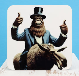 TwoAcreTees.com Garth The Sasquatch On A Moose Square Coaster