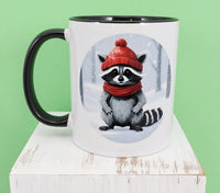 Percy The Cozy Raccoon Black Handle Mug