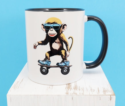 TwoAcreTees.com Reuben The Skateboarding Monkey Black Handle Mug